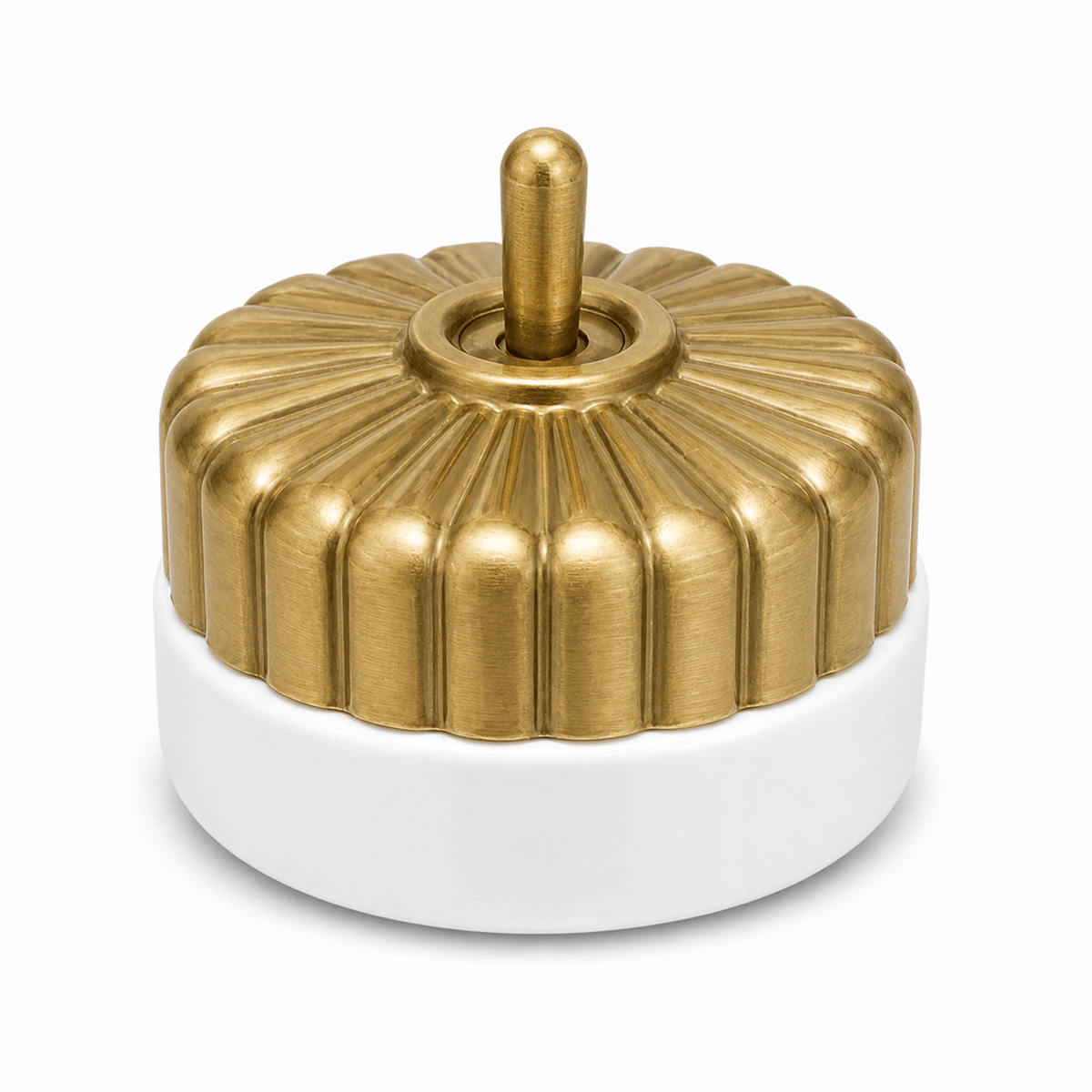 Heritage brass and porcelain fluted switch on a white background