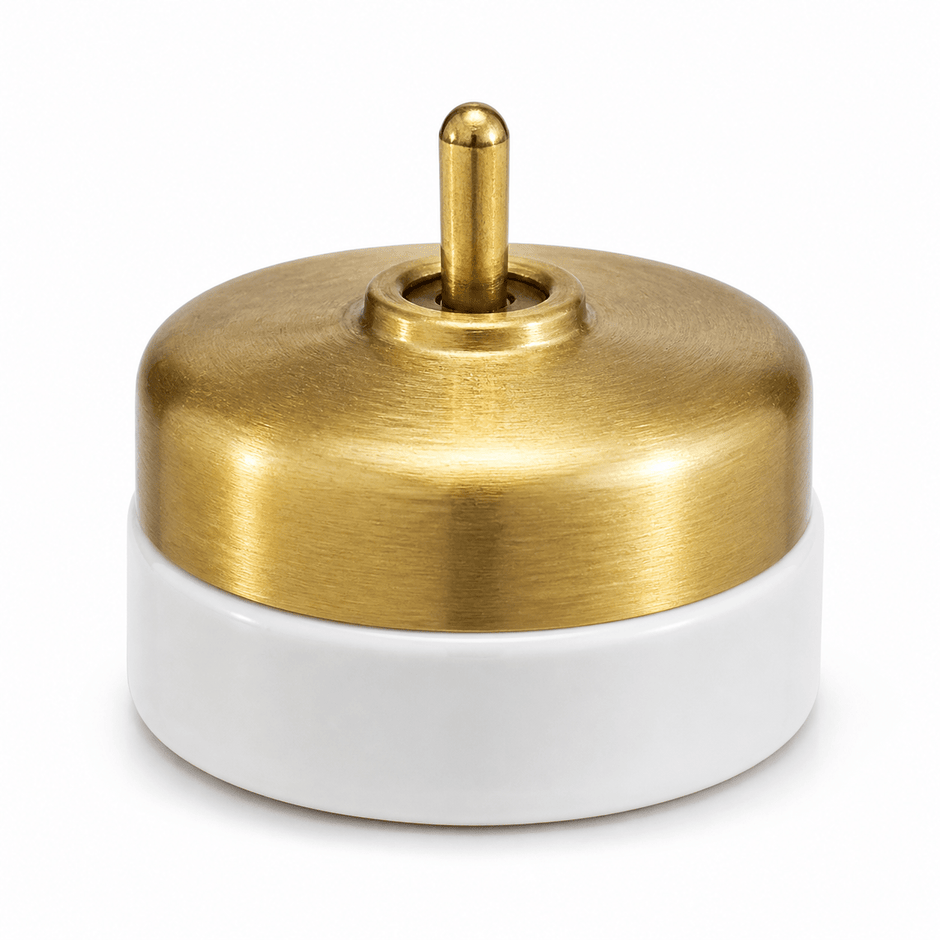 Brass and porcelain switch for a modern heritage interior