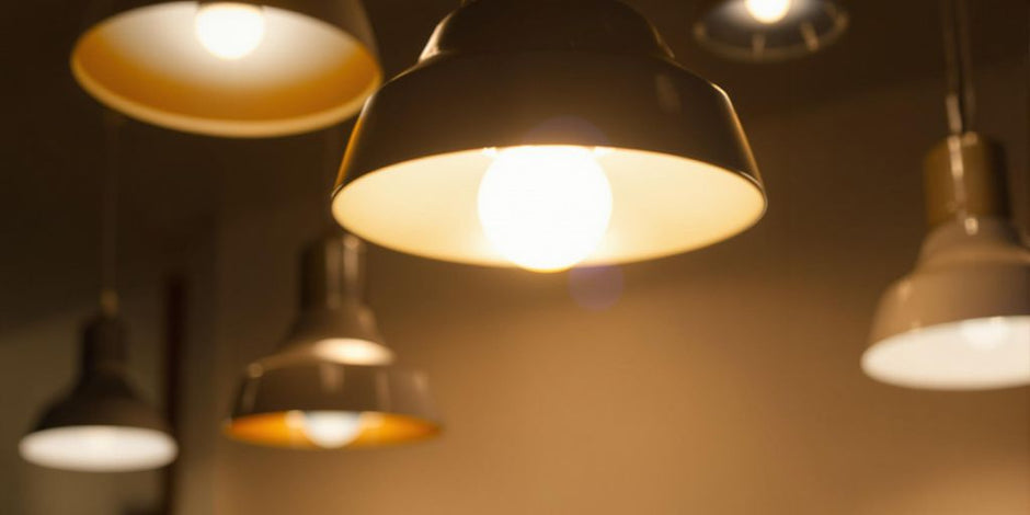 Dimmable LED bulb glowing warmly in a stylish setting.
