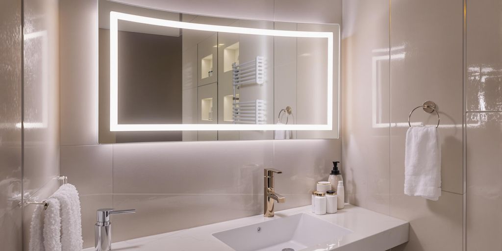 Stylish bathroom with a modern LED mirror.
