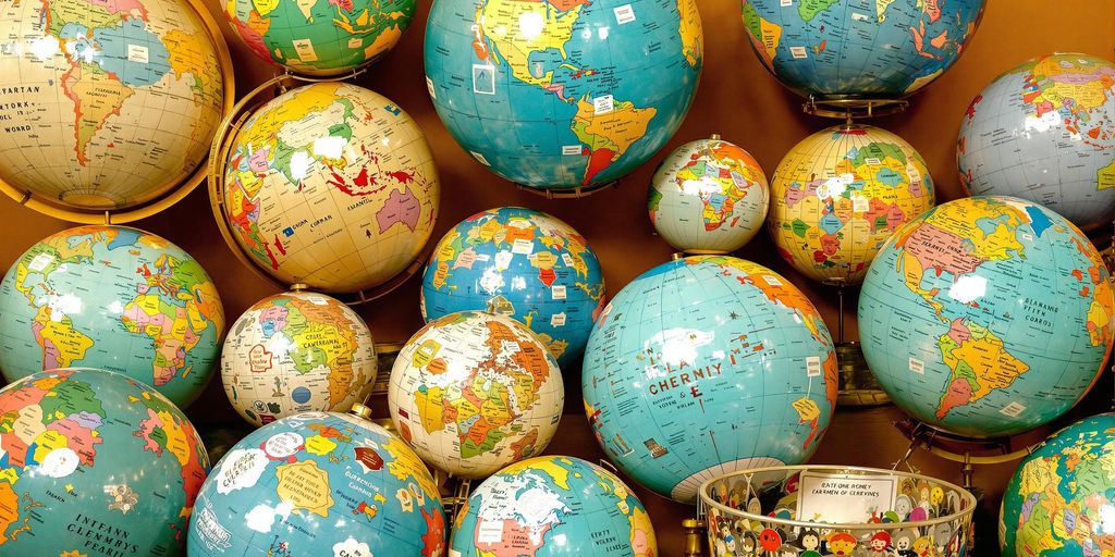 A variety of decorative globes on display.