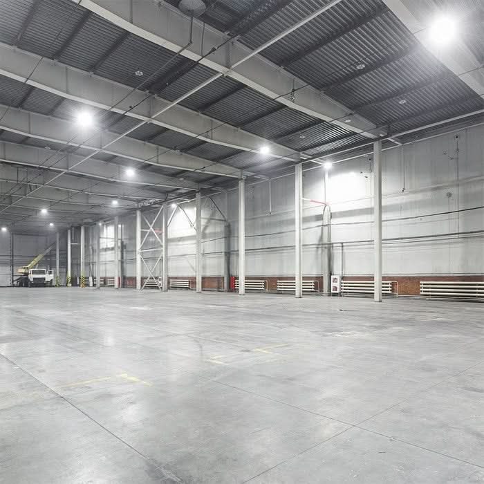 Large warehouse interior illuminated by LED high-bay fittings