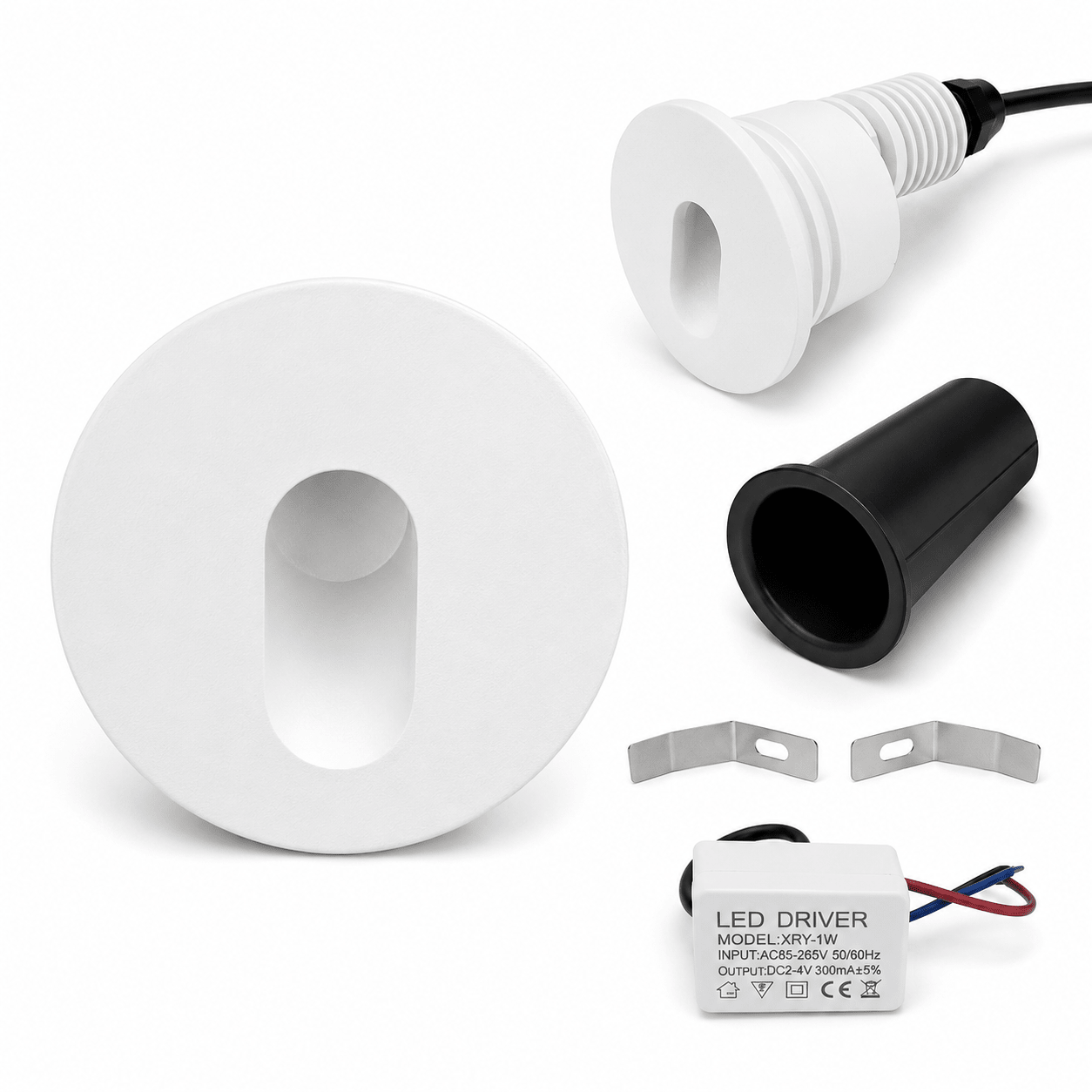 Components of a white LED round recessed step light including housing, LED driver, and installation clips.