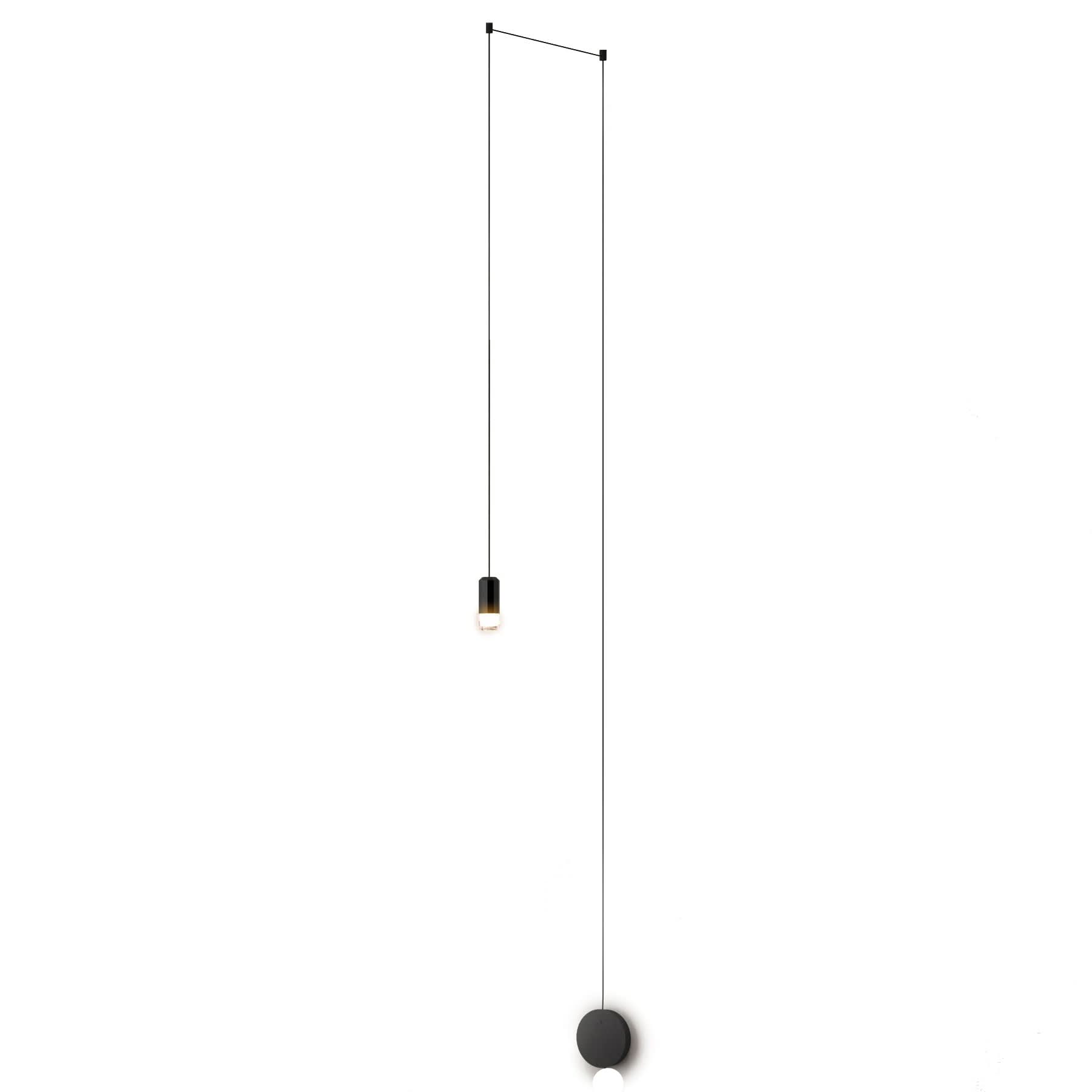 Minimalist pendant light with black fixture and cable on a white background