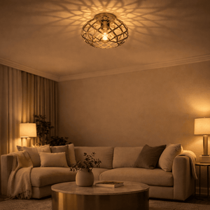 Gold nest-style flush ceiling light casting warm patterns in a cozy living room setting.