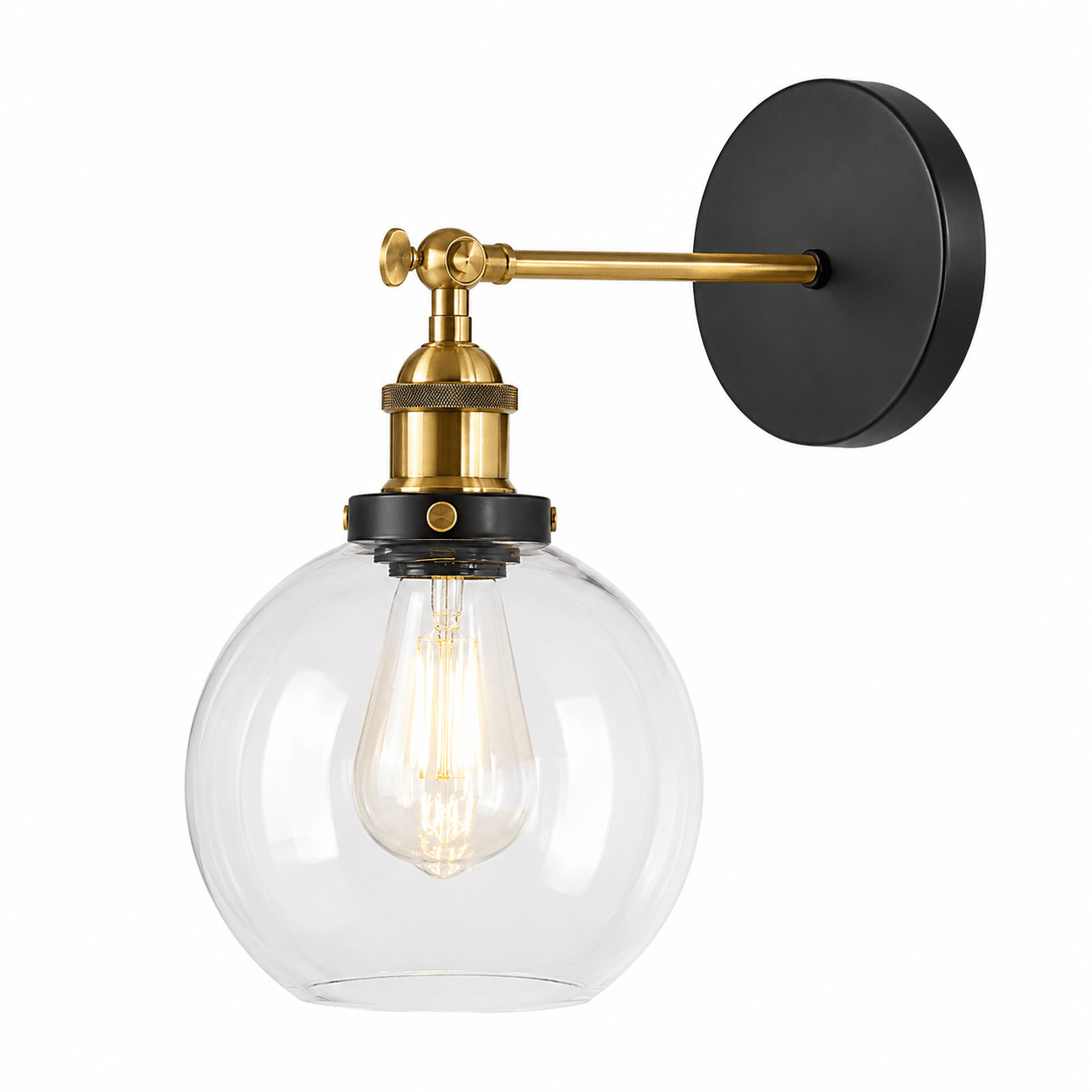 Antique brass wall light with clear glass globe, showcasing elegant design and warm illumination.