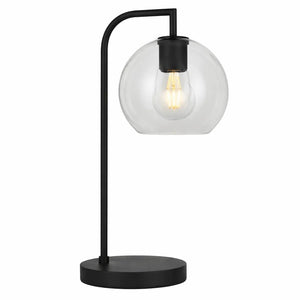 Inspiration Table Lamp featuring a black metal frame and clear glass shade, providing a warm glow.