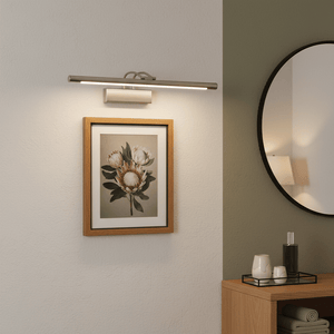 5W Satin Picture Light illuminating a framed artwork in a modern interior setting.
