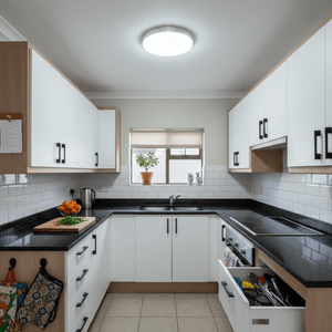 Modern kitchen featuring a flush-mounted LED ceiling light, brightening the space with even illumination.