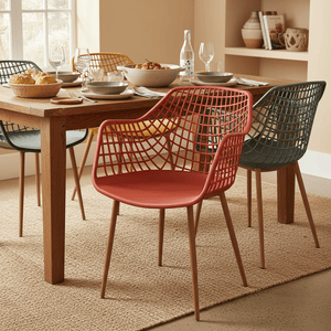 Coral Diamond Back Chair at a dining table, surrounded by various dishes and other colorful chairs.