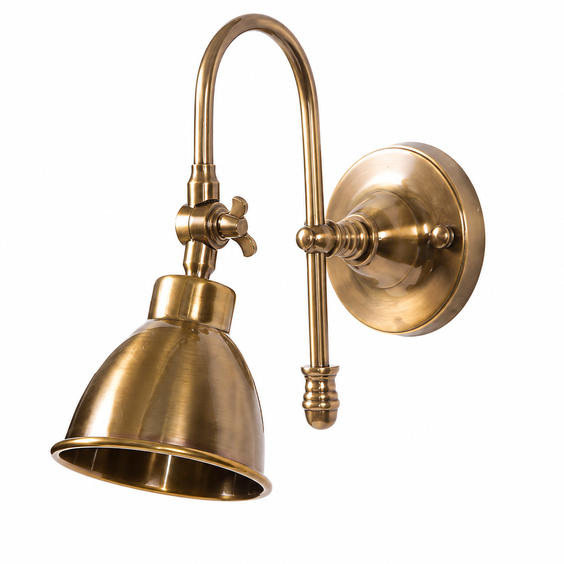 An adjustable wall sconce with a bell-shaped shade, featuring a curved gooseneck arm and a round wall mount, finished in antique brass.