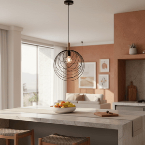 Modern retro black pendant light with wooden detail hanging above a kitchen island with a fruit bowl.