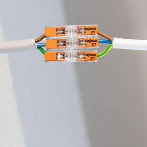 Cable with colored wago connectors on a gray background