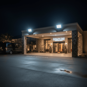 Coastal floodlight illuminating the entrance of a building at night, enhancing visibility and safety.