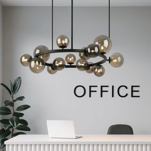 Modern chandelier hanging above a desk with 'OFFICE' text on a gray wall.