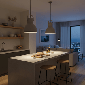 Modern kitchen island with 2 grey pendant lights.