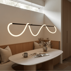 Modern pendant light with a black bar and glowing wavy LED tube hanging above a dining table