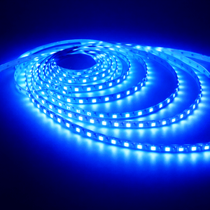 Roll of blue LED strip light on a dark background