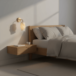 Dahlia 3D printed wall light mounted beside a wooden bed with soft bedding and a nightstand.