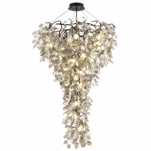 Grand Cascade Chandelier in black with cascading leaf design and warm lights.