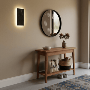 Wooden console table with a mirror above it in a room setting.