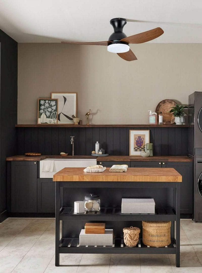 Dining space with wood ceiling fan and pendant lights layered for task and ambient lighting in a South African home