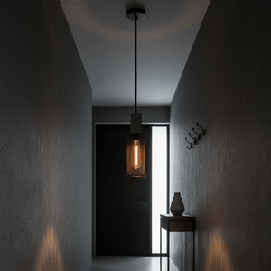 Midnight Long Mesh & Stone Pendant Light illuminating a modern hallway with textured walls and a console table.