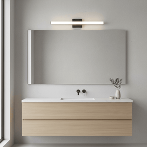Sandy black LED light mounted above a large mirror in a modern bathroom setting.