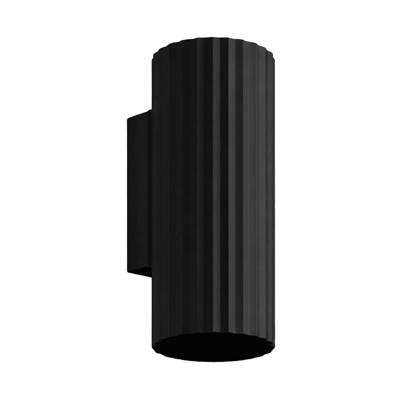 Black cylindrical wall light with vertical ribbed texture, mounted on a flat black base.