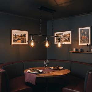 3-light black and chrome grid pendant illuminating a cozy dining nook with plates and wine glasses.