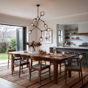 Stylish dining area featuring a 7-light molecule pendant above a wooden table with chairs and decor.