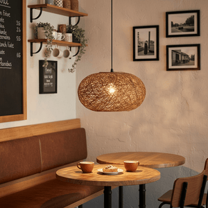 Twine Pendant 500mm hanging above a cozy table setting with coffee cups and pastries.