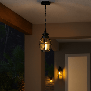 Outdoor pendant light fixture hanging from a ceiling with a warm glow.
