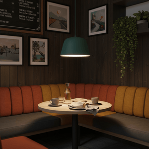 Teal Cupcake Pendant Light hanging above a cozy dining table with colorful seating and decor.