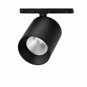 Black adjustable LED track spot light with a cylindrical design and clear lens, mounted on a track.