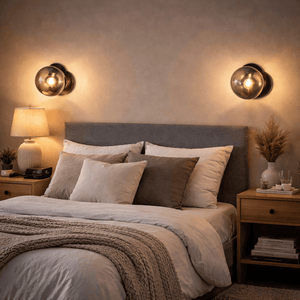 Bubble Glass Wall Light mounted above a bed, providing warm accent lighting in a cozy bedroom setting.