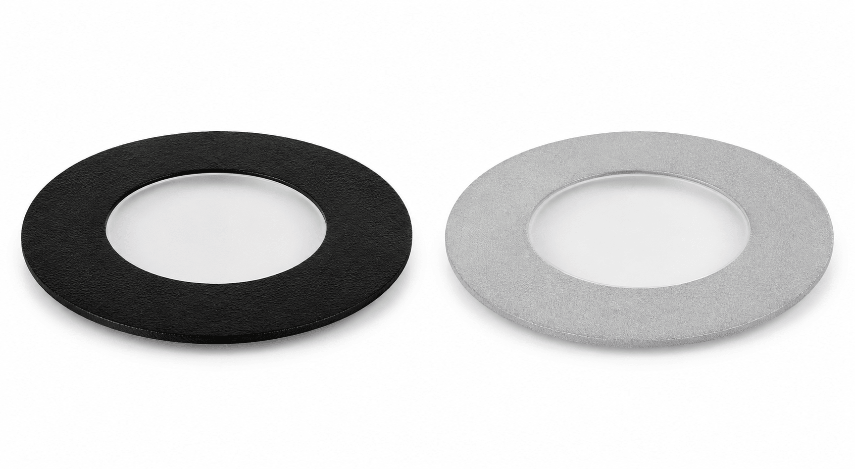Two circular light covers in black and silver, showcasing design options for the Ceci 90 Ground Light.