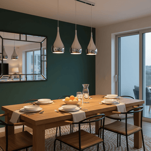 Three-light pendant light above a wooden dining table set with plates and fruit, reflecting a modern aesthetic.