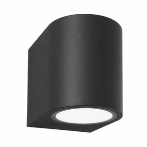 Black LED outdoor wall light with a sleek design, ideal for coastal settings.