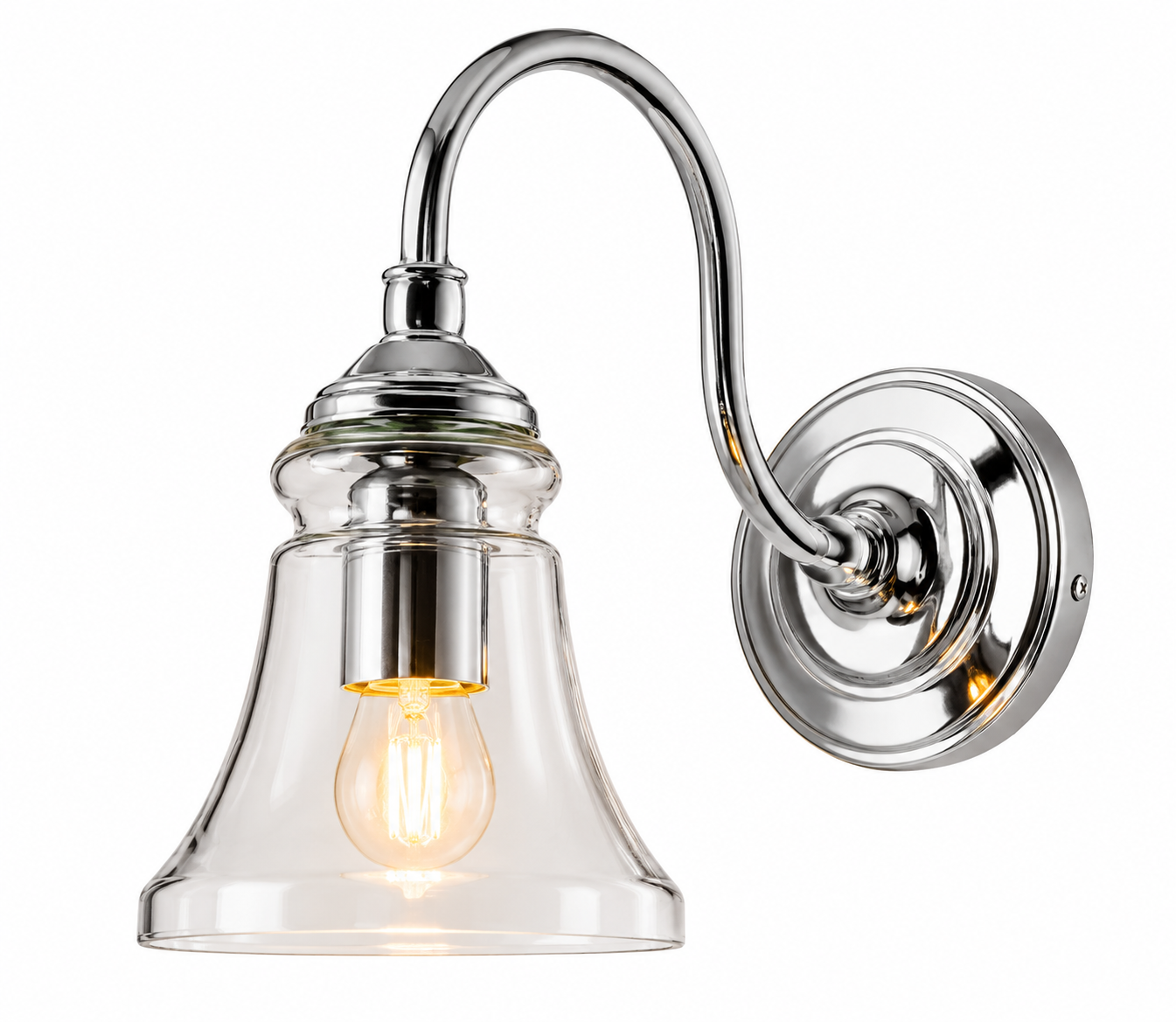 A wall-mounted sconce light fixture with a polished chrome curved arm and circular wall plate, featuring a clear glass bell shade and a glowing warm Edison-style bulb, shown on a white background.
