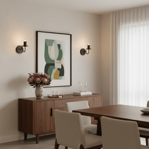 Modern black indoor wall lights flanking an abstract artwork in a stylish dining area.