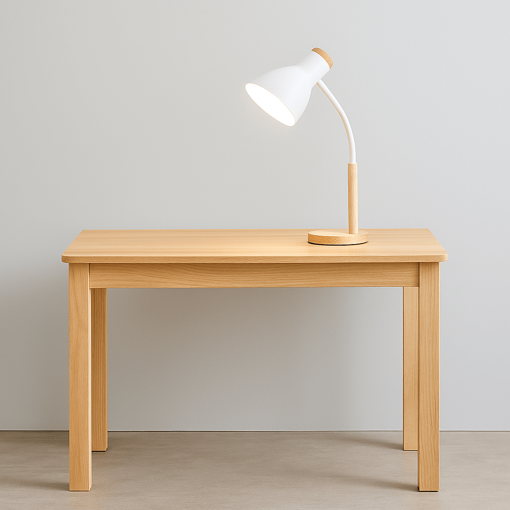 A modern white table lamp with a flexible arm on a wooden table against a neutral wall.