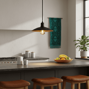 Golden Shell Pendant light hanging above a kitchen island with fruit bowl and mugs.