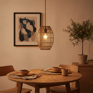 Twine Pendant Coffee light hanging above a wooden dining table set with bowls and cups, creating a warm ambiance.
