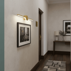 Gold slim LED linear light mounted above a framed black and white photo in a stylish hallway.