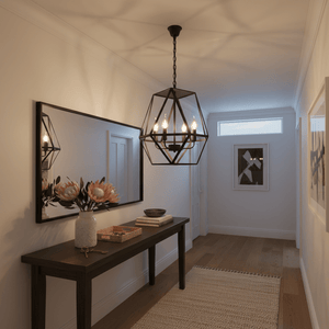 A stylish chandelier hangs above a wooden console table adorned with flowers and decor in a well-lit hallway.