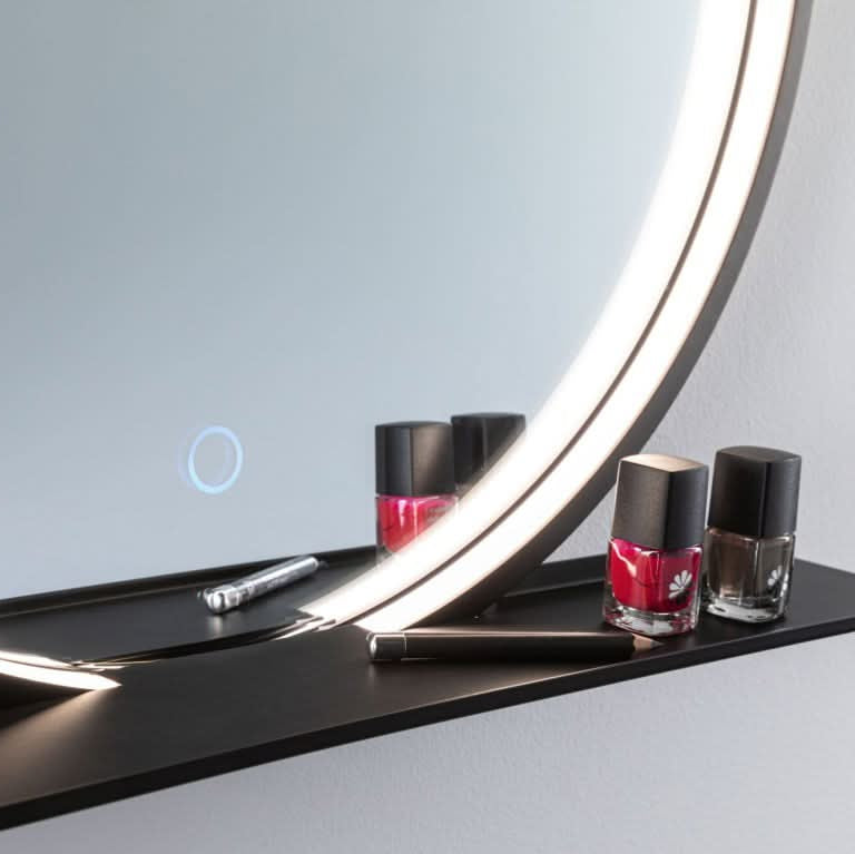 Close-up of the Claudia CCT LED Mirror showcasing its sleek design and adjustable lighting feature, with nail polish