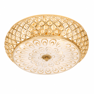 Decorative ceiling light fixture with gold and white design on a white background