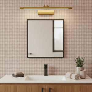 Antique bronze picture light mounted above a mirror in a modern bathroom setting.