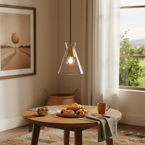 Black & Gold Cleopatra 1 Light Pendant Light hanging above a wooden dining table with pastries and fruit.